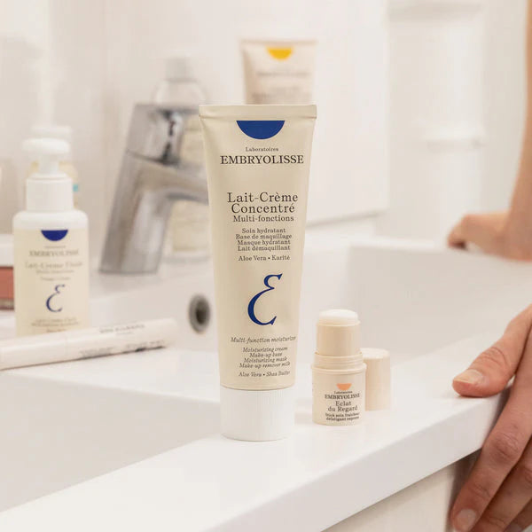 Embryolisse Lait-Crème Concentré in its signature white and blue tube. The multi-purpose moisturizer trusted by makeup artists worldwide.